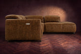 Octavia sectional in Weathered Saddle on a walnut herringbone floor, seen from the arm end, footrests closed, Right bumper.