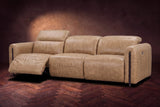 The Octavia 3 seat in Washed Sand distressed full leather on a dark herringbone floor, seen from the right, the left recliner open and its headrest raised. Shown in Washed Sand, 3 seat.
