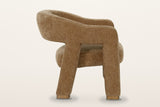 Opi accent chair from the side on a warm white studio backdrop: an open window under the arm, the back legs raked back