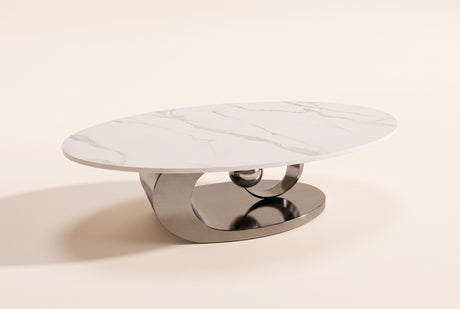 The Oriana coffee table in Gray, front three-quarter view: a white veined sintered stone oval top on a polished gunmetal grey stainless steel base of a plinth, a ring and a sphere, on an off-white studio background