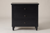 Ortona nightstand in Black, straight front view: moulded top, three drawers with round bronze-tone knobs, four turned legs