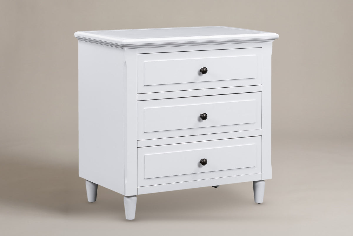 Ortona 3-drawer nightstand in White, three-quarter view on a warm grey studio backdrop