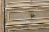 Close-up of the Natural White finish: white-washed open ash grain with distressed edges on the framed drawer fronts