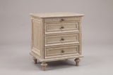 Osimo farmhouse nightstand in Natural White, three-quarter view on a warm grey studio backdrop: pull-out tray