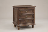 Osimo farmhouse nightstand in Walnut Brown, three-quarter view on a warm grey studio backdrop: pull-out tray