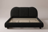 Padula cloud bed in black, straight front view showing the three-panel headboard and the slats