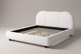 Padula cloud bed in white teddy bouclé, three-quarter view on a warm light-grey studio backdrop