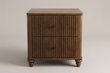 Palestrina nightstand in Walnut, straight front view: two fluted drawers with round black knobs, rounded corner posts