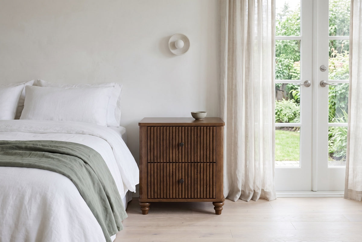 Palestrina nightstand in Walnut beside a white linen bed in a bright Victoria bedroom with French doors to the garden