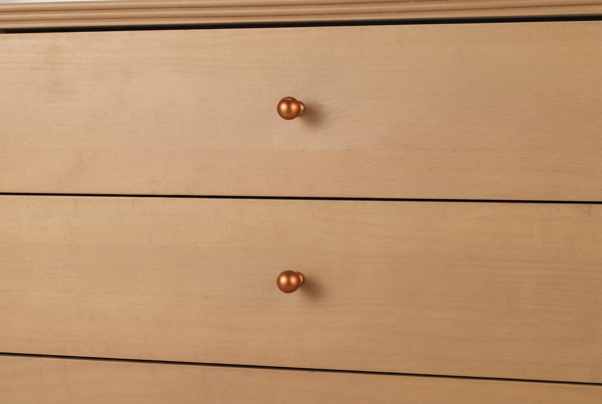 Close-up of two Parma drawer fronts with their copper-tone ball knobs and the grooved surround above