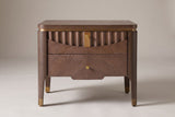 Pavia nightstand in Brown, front view: a fluted wave across the top drawer, a gold-tone plate and two gold-tone knobs
