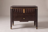 Pavia nightstand in Dark Brown, front view: a fluted wave across the top drawer, a gold-tone plate and two gold-tone knobs