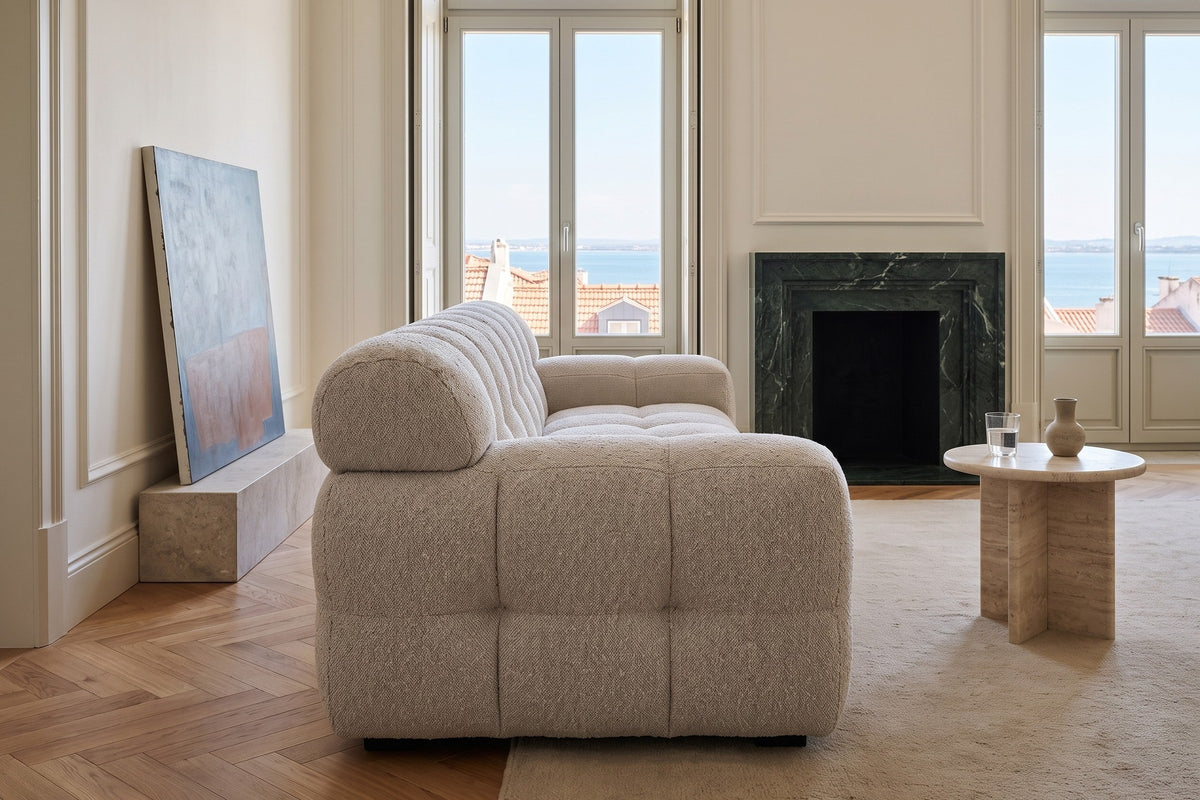 Pergola sofa in Beige seen from its end in a Lisbon apartment, white plaster mouldings
