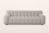 Pergola sofa in Beige, straight front view on a warm white studio backdrop: ten channels across the back and eight across