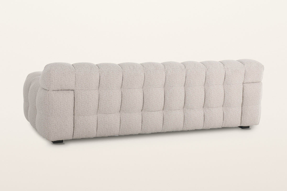 Pergola sofa in Beige from the back at three-quarter on a warm white studio backdrop
