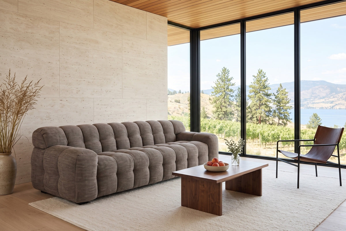 Pergola sofa in Brown seen from above at the front left in a Penticton house, travertine walls