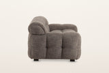 Pergola sofa in Brown, side view on a warm white studio backdrop: a round roll at the end of the back above the low puffed ar