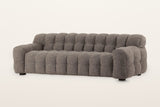Pergola sofa in Brown, three-quarter view on a warm white studio backdrop