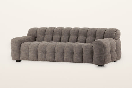 Pergola sofa in Brown, three-quarter view on a warm white studio backdrop