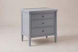 Pescara nightstand in Slate Gray, three-quarter view on a warm grey studio backdrop