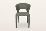 Petralia dining chair in Green, straight front view on a warm white studio backdrop: the open window between the seat