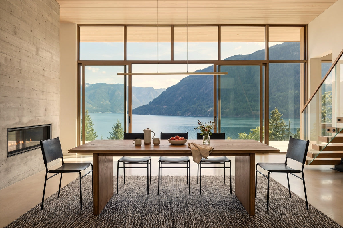 Pettorano dining table in Brown in a Nelson house above Kootenay Lake: a tall glass wall to the lake and mountains