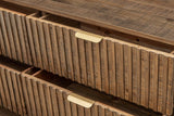Close-up of two Pettorano drawers pulled open: rounded pine reeds with uneven ends and a curved brass pull on each top edge