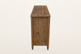 End view of the Pettorano dresser in Brown on a warm white studio backdrop: vertical pine planks between two round posts that