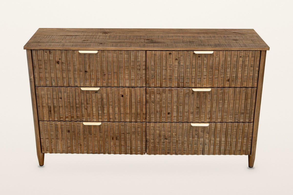 Pettorano dresser in Brown, straight front view on a warm white studio backdrop: six equal reeded drawers in three rows of tw