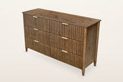 Pettorano 6-drawer dresser in Brown reclaimed pine, three-quarter view on a warm white studio backdrop: a planked top