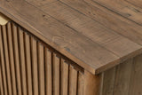 Close-up of the Pettorano top corner in Brown: reclaimed pine planks with saw marks and knots above the slatted doors and a r