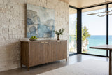 Pettorano sideboard in Brown against a dry-stack limestone wall in a Wiarton escarpment house, with abstract art