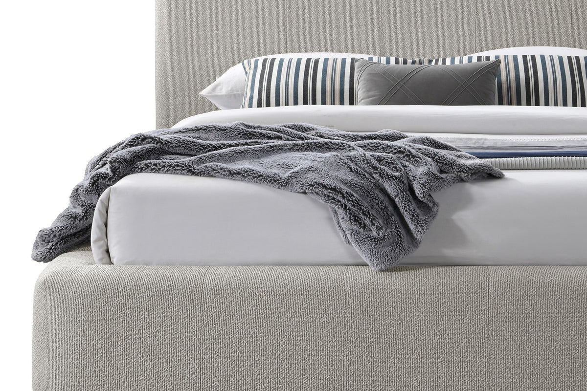 Pierce King platform bed in mushroom fabric, close view of padded footboard and headboard