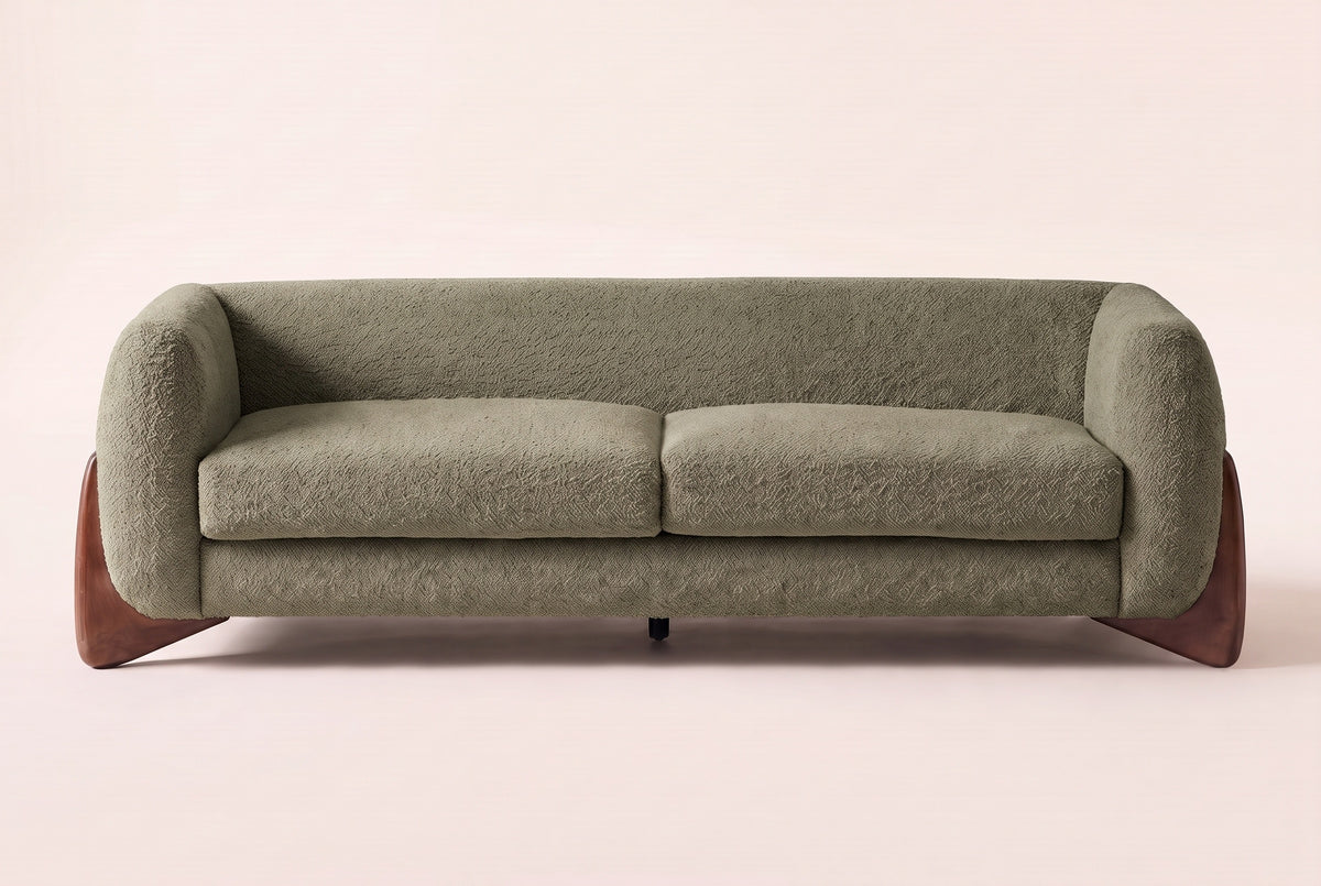 Pistoia sofa in Olive Green boucle, straight front view: rounded wrap-around arms, two seat cushions and walnut wedge feet