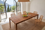 Polcenigo dining table in Dark Burl seen from above at the corner in a cliff-top villa, with white plaster vaults
