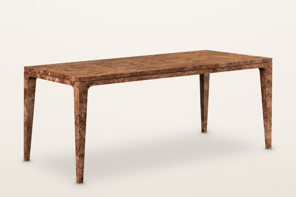 Polcenigo burl dining table in Dark Burl, three-quarter view on a warm white studio backdrop