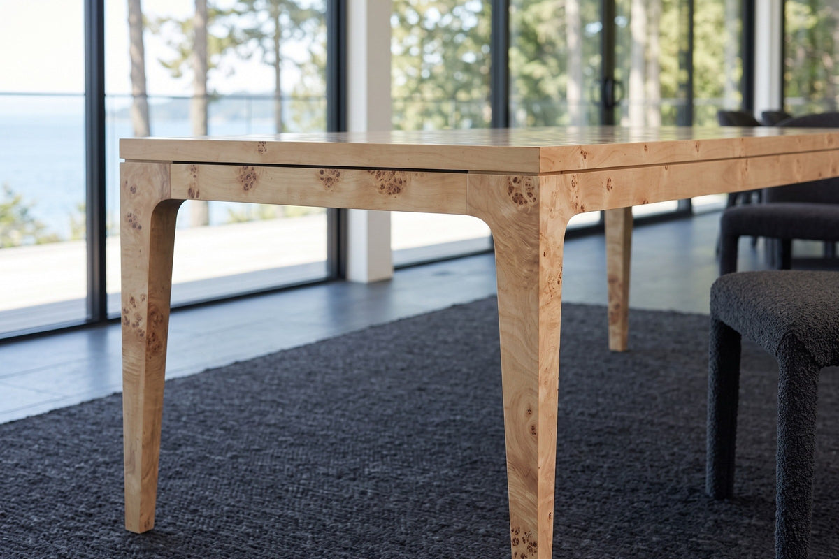 The Polcenigo legs in Honey Blonde Burl at seat height: square tapered legs that curve into the apron