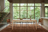 Polcenigo dining table in Honey Blonde Burl in an Oakville ravine house, with a floating stair