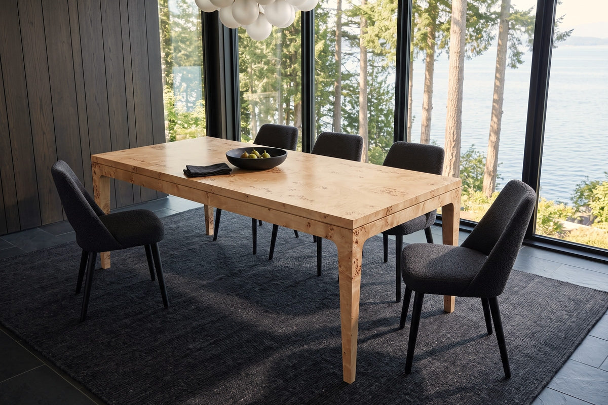 Polcenigo dining table in Honey Blonde Burl seen from above at the corner in a Powell River house, with smoked-oak panelling