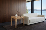 Polcenigo side table in Honey Blonde Burl at the arm of an ivory boucle sofa in a Sidney house