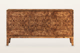 Polcenigo sideboard in Dark Burl, straight front view on a warm white studio backdrop: three equal flush doors in a slim fram