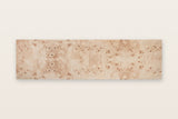 Top view of the Polcenigo sideboard in Honey Blonde Burl on a warm white backdrop, showing the book-matched burl top