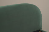 Close-up of the rounded corner of the Pollutri headboard in dark green velvet