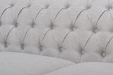 Close-up of the deep button tufting on the grey back of the Portovenere sofa
