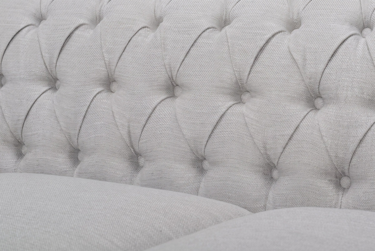 Close-up of the deep button tufting on the grey back of the Portovenere sofa
