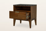 Postignano nightstand in Walnut with its drawer pulled out on a metal slide, on a warm white studio backdrop