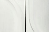 Close-up of two Pragelato doors: the curve of a raised arch beside the straight side of a raised inverted arch, white wash over a fine mango grain