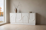 Pragelato white sideboard against a warm greige limewash wall in a North Hatley, Quebec dining room, maples and the lake through the window