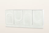 Pragelato 76 in sideboard in white-washed mango wood: four doors with raised arches that alternate up and down, no handles, on a deep plinth, three-quarter view on a warm white studio backdrop