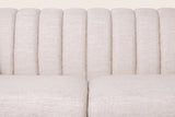 Close-up of the channel-stitched back and the two beige seat cushions
